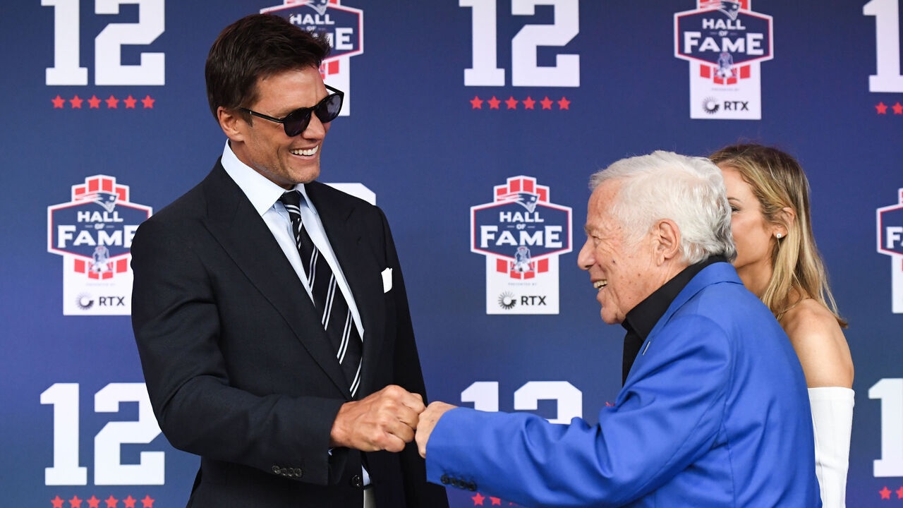 FOXBOROUGH, MASSACHUSETTS - JUNE 12: Tom Brady fist bumps New England Patriots CEO Robert Kraft prior to the 2024 Hall of Fame Induction Ceremony for Tom Brady at Gillette Stadium on June 12, 2024 in Foxborough, Massachusetts.
