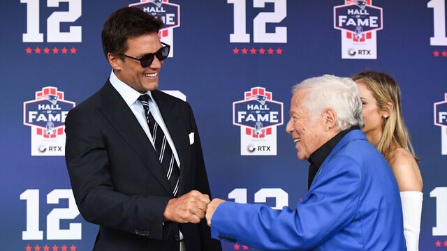 FOXBOROUGH, MASSACHUSETTS - JUNE 12: Tom Brady fist bumps New England Patriots CEO Robert Kraft prior to the 2024 Hall of Fame Induction Ceremony for Tom Brady at Gillette Stadium on June 12, 2024 in Foxborough, Massachusetts.