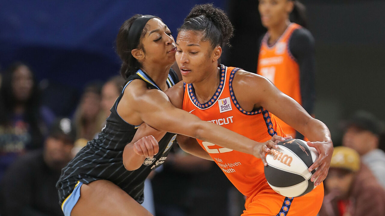CHICAGO, IL - JUNE 12: Angel Reese #5 of the Chicago Sky steals the ball Alyssa Thomas #25 of the Connecticut Sun during the second half on June 12, 2024 at Wintrust Arena in Chicago Illinois.