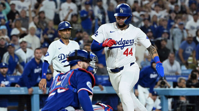 LOS ANGELES, CA - JUNE 12: Los Angeles Dodgers center fielder Andy Pages (44) tries to tie the game up in the ninth inning while Texas Rangers catcher Jonah Helm (28) waits for the throw during an MLB baseball game played on June 12, 2024 at Dodger Stadium in Los Angeles, CA.