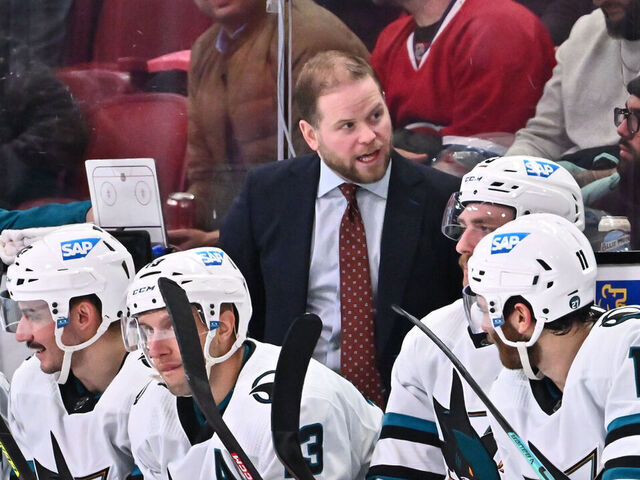MONTREAL, CANADA - NOVEMBER 29: Assistant coach Ryan Warsofsky of the San Jose Sharks handles bench duties during the third period against the Montreal Canadiens at Centre Bell on November 29, 2022 in Montreal, Quebec, Canada. The San Jose Sharks defeated the Montreal Canadiens 4-0.