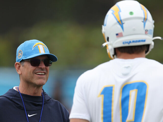 COSTA MESA, CALIFORNIA - MAY 20: Head coach Jim Harbaugh and quarterback Justin Herbert during a Los Angeles Chargers OTA offseason workout on May 20, 2024 in Costa Mesa, California.