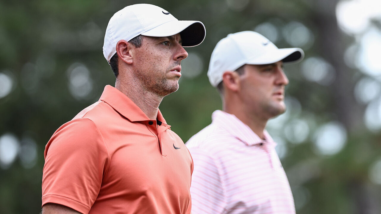 PINEHURST, NORTH CAROLINA - JUNE 13: Rory McIlroy of Northern Ireland and Scottie Scheffler of the United States walk off the ninth tee during the first round of the 124th U.S. Open at Pinehurst Resort on June 13, 2024 in Pinehurst, North Carolina.