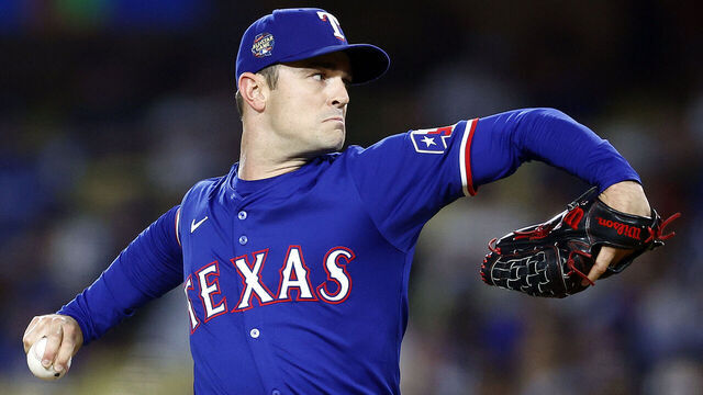 LOS ANGELES, CALIFORNIA - JUNE 13: David Robertson #37 of the Texas Rangers throws against the Los Angeles Dodgers in the eighth inning at Dodger Stadium on June 13, 2024 in Los Angeles, California.