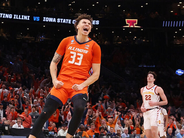 BOSTON, MASSACHUSETTS - MARCH 28: Coleman Hawkins #33 of the Illinois Fighting Illini celebrates a dunk by Terrence Shannon Jr. #0 against the Iowa State Cyclones during the first half at TD Garden on March 28, 2024 in Boston, Massachusetts.