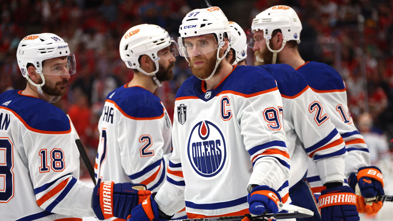 SUNRISE, FLORIDA - JUNE 08: Connor McDavid #97 and Zach Hyman #18 of the Edmonton Oilers are seen with their teammates during the first period of Game One of the 2024 Stanley Cup Final between the Edmonton Oilers and the Florida Panthers at Amerant Bank Arena on June 08, 2024 in Sunrise, Florida.