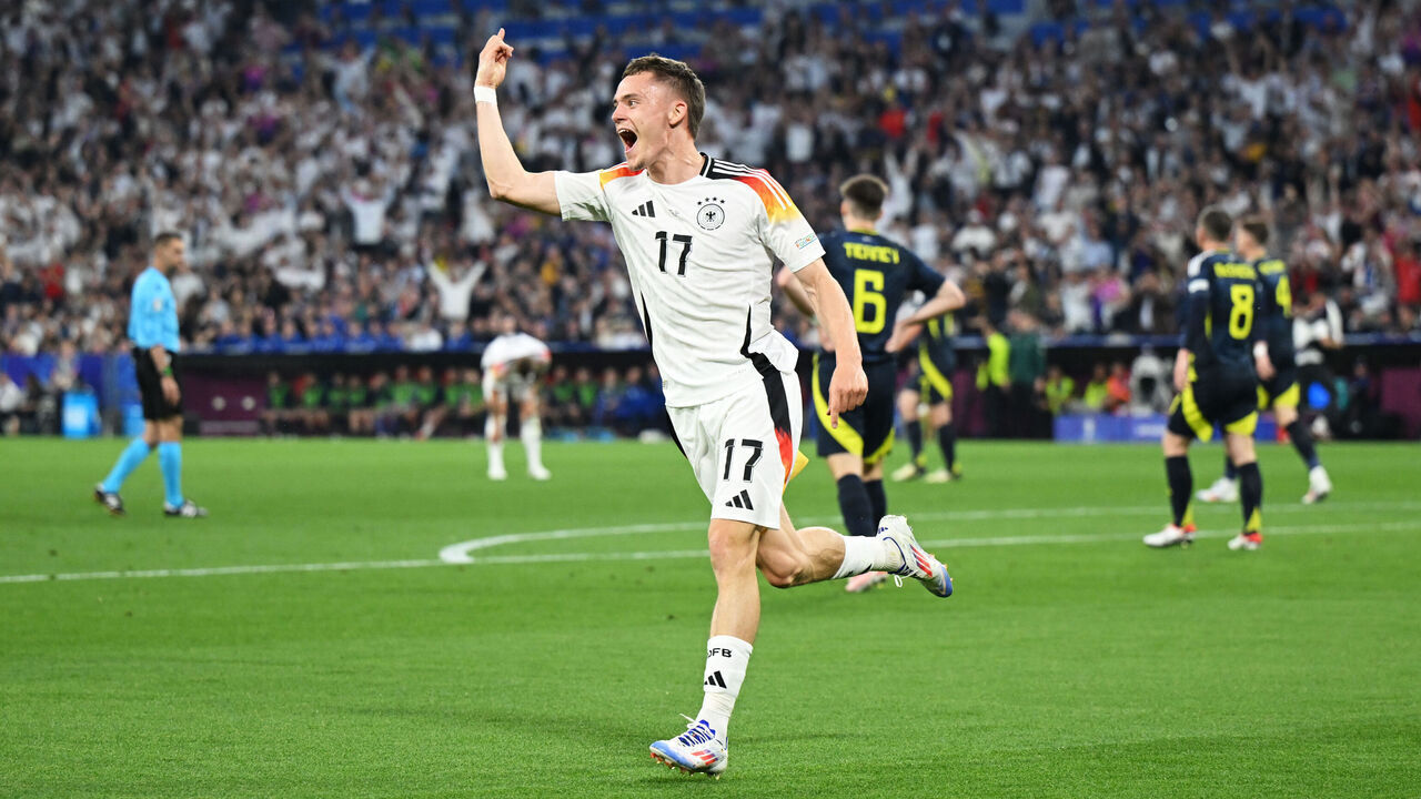 MUNICH, GERMANY - JUNE 14: Florian Wirtz of Germany celebrates scoring his team's first goal during the UEFA EURO 2024 group stage match between Germany and Scotland at Munich Football Arena on June 14, 2024 in Munich, Germany.