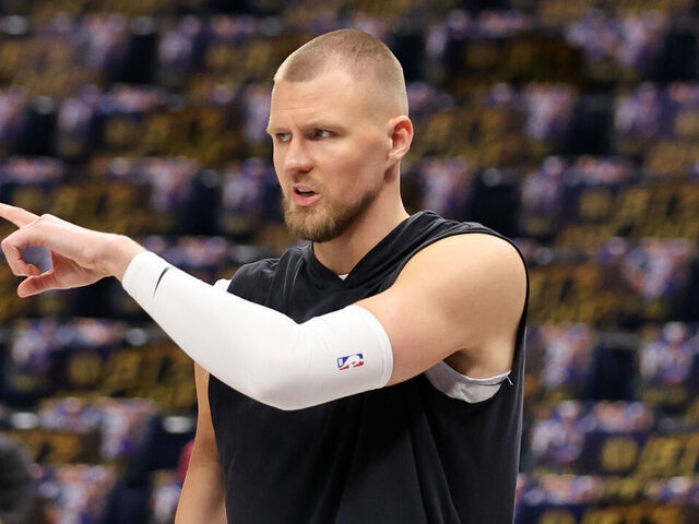 DALLAS, TEXAS - JUNE 14: Kristaps Porzingis #8 of the Boston Celtics warms up prior to Game Four of the 2024 NBA Finals against the Dallas Mavericks at American Airlines Center on June 14, 2024 in Dallas, Texas.