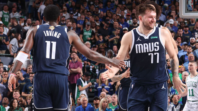 DALLAS, TX - JUNE 12: Luka Doncic #77 high fives Kyrie Irving #11 of the Dallas Mavericks during the game against the Boston Celtics during Game 3 of the 2024 NBA Finals on June 12, 2024 at the American Airlines Center in Dallas, Texas. Mandatory Copyright Notice: Copyright 2024 NBAE