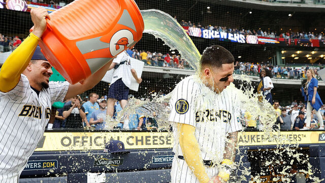 MILWAUKEE, WISCONSIN - JUNE 15: Joey Ortiz #3 of the Milwaukee Brewers has Gatorade dumped on him by Willy Adames #27 after a 3-1 win over the Cincinnati Reds at American Family Field on June 15, 2024 in Milwaukee, Wisconsin.