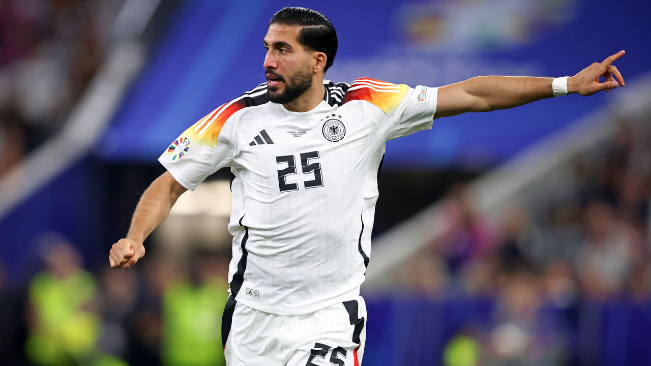 MUNICH, GERMANY - JUNE 14: Emre Can of Germany gives his team instructions during the UEFA EURO 2024 group stage match between Germany and Scotland at Munich Football Arena on June 14, 2024 in Munich, Germany.