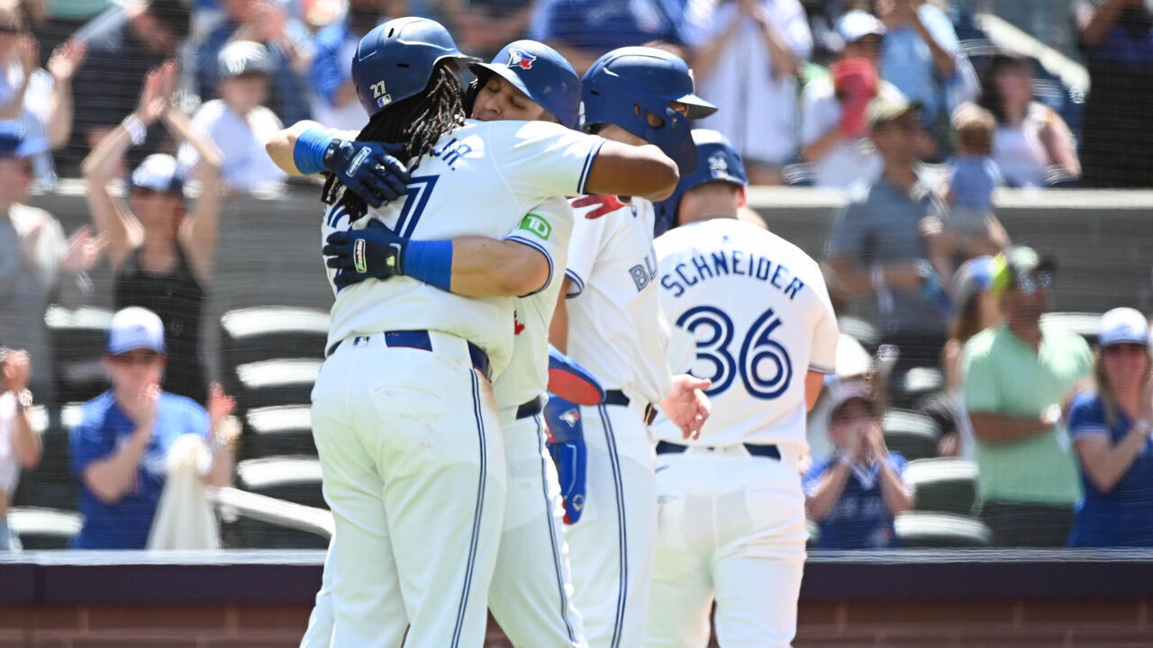 TORONTO, ON - JUNE 16: Daulton Varsho #25 of the Toronto Blue jays hugs Vladimir Guerrero Jr. #27 after hitting a grand slam in the fifth inning during the game between the Cleveland Guardians and the Toronto Blue Jays at Rogers Centre on Sunday, June 16, 2024 in TorontoOntario, Canada.