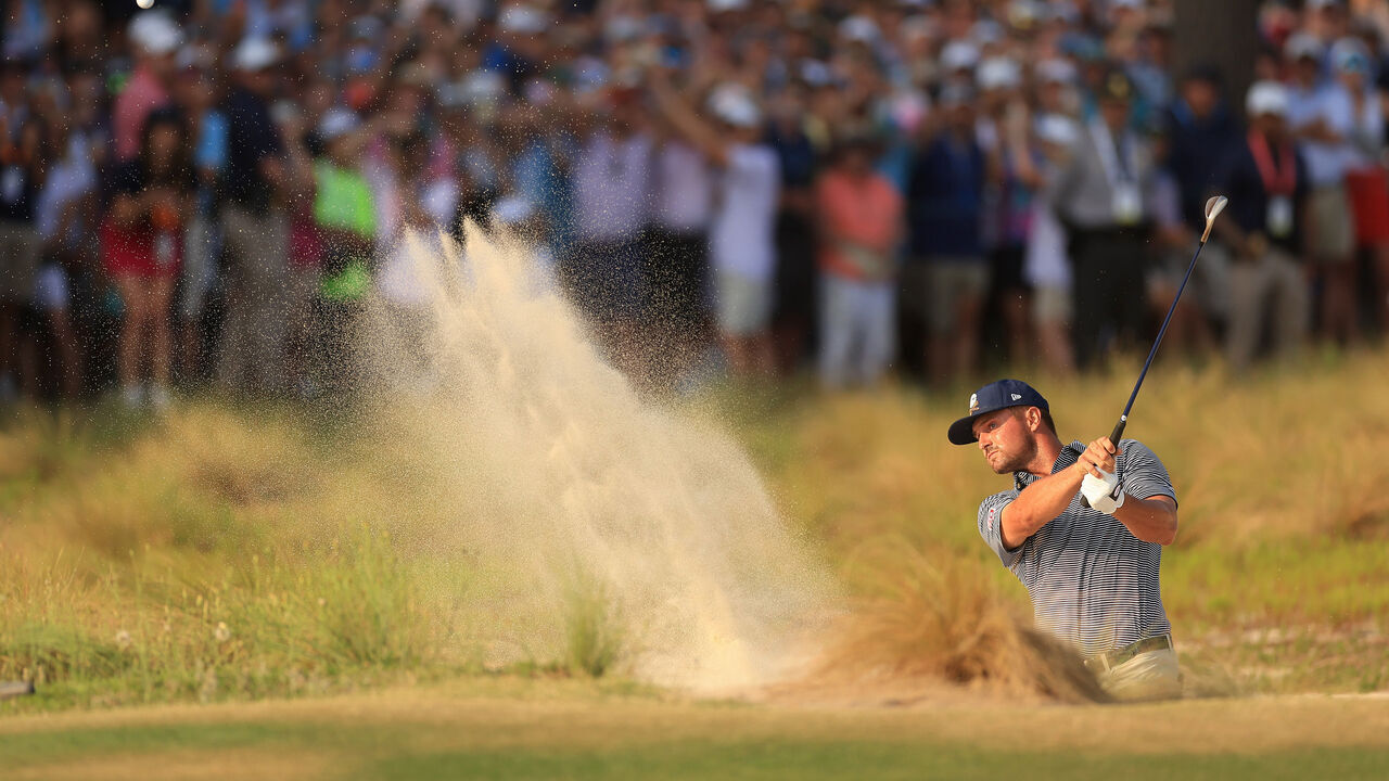 PINEHURST, NORTH CAROLINA - JUNE 16: Bryson DeChambeau of the United States hits out of a greenside bunker on the 18th hole during the final round of the 124th U.S. Open at Pinehurst Resort on June 16, 2024 in Pinehurst, North Carolina.