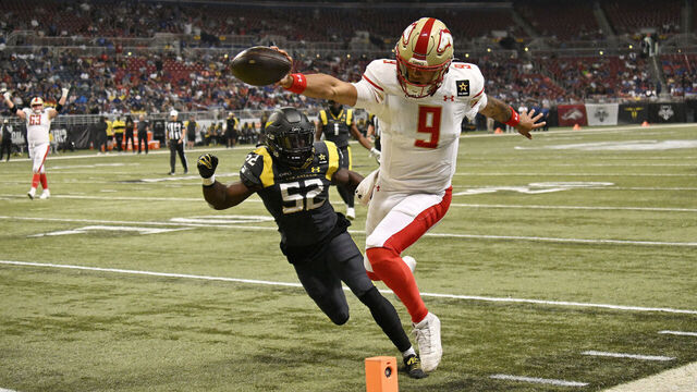 ST LOUIS, MISSOURI - JUNE 16: Adrian Martinez #9 of the Birmingham Stallions scores a touchdown against Joel Iyiegbuniwe #52 of the San Antonio Brahmas during the third quarter of the UFL Championship Game at The Dome at America’s Center on June 16, 2024 in St Louis, Missouri.