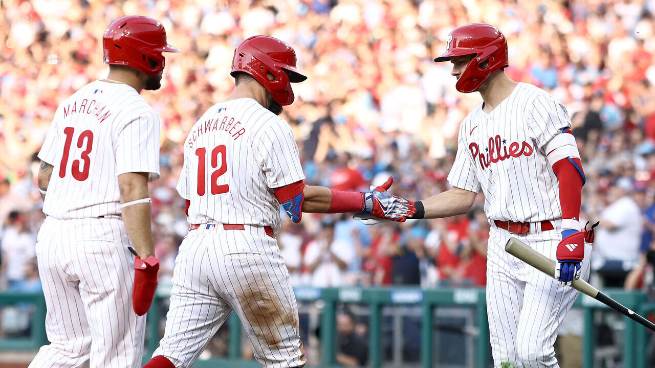 PHILADELPHIA, PENNSYLVANIA - JUNE 17: Kyle Schwarber #12 and Trea Turner react following a two run home run by Schwarber during the third inning against the San Diego Padresat Citizens Bank Park on June 17, 2024 in Philadelphia, Pennsylvania.