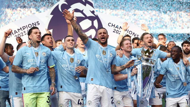 MANCHESTER, ENGLAND - MAY 19: Kyle Walker of Manchester City celebrates on the stage with teammates as Kevin De Bruyne lifts The Premier League Trophy after the Premier League match between Manchester City and West Ham United at Etihad Stadium on May 19, 2024 in Manchester, England.