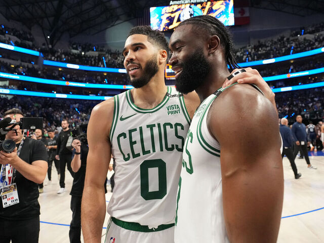 DALLAS, TX - JUNE 12: Jayson Tatum #0 and Jaylen Brown #7 of the Boston Celtics smile after the game against the Dallas Mavericks during Game 3 of the 2024 NBA Finals on June 12, 2024 at the American Airlines Center in Dallas, Texas. Mandatory Copyright Notice: Copyright 2024 NBAE