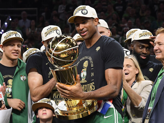 BOSTON, MA - JUNE 17: Al Horford #42 of the Boston Celtics of the Boston Celtics celebrates with the Larry O'Brien Trophy after the game against the Dallas Mavericks during Game 5 of the 2024 NBA Finals on June 17, 2024 at the TD Garden in Boston, Massachusetts. Mandatory Copyright Notice: Copyright 2024 NBAE