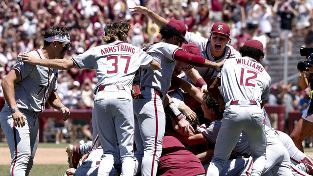 TALLAHASSEE, FL - JUNE 08: The Florida State Seminoles celebrates after game 2 on the field after beating the UConn Huskies in the 2024 NCAA Baseball Super Regional on Mike Martin Field at Dick Howser Stadium on June 8, 2024 in Tallahassee, Florida. The Seminoles defeated the UConn Huskies 10-8 in 12 innings to advance to the College World Series for the 24th time in the program history.