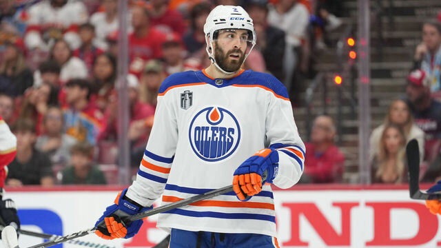 SUNRISE, FL - JUNE 08: Edmonton Oilers defenseman Evan Bouchard (2) eyes a teammate in the second period during game one of the Stanley Cup Finals between the Edmonton Oilers and the Florida Panthers on Saturday, June 8, 2024 at Amerant Bank Area in Sunrise, Fla.