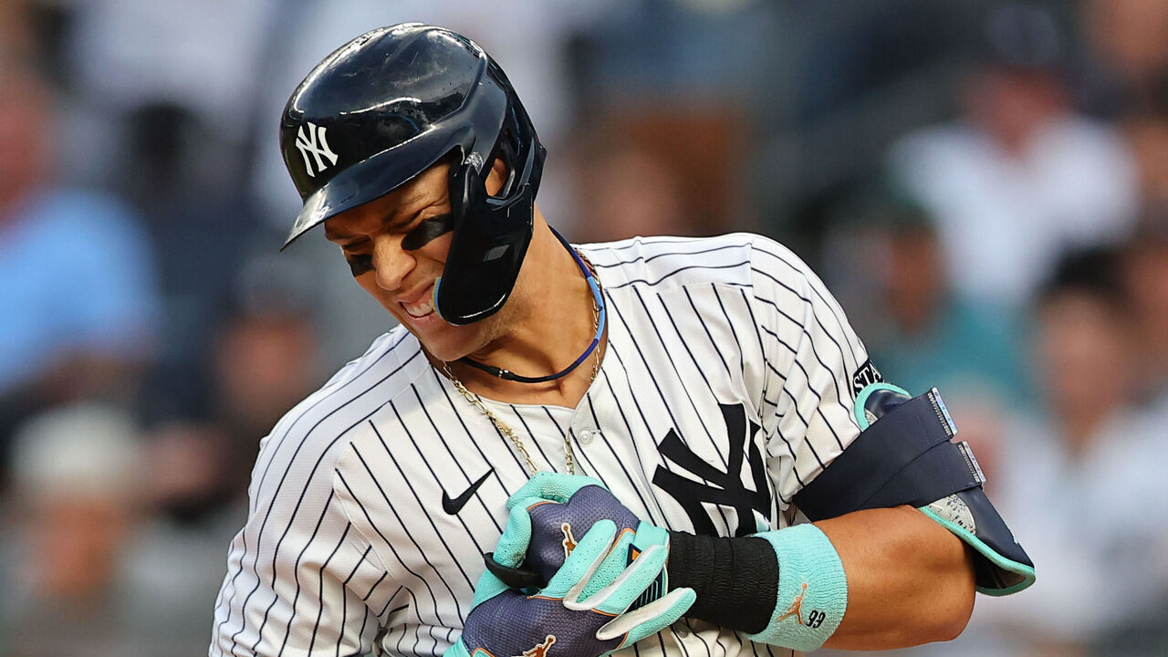 BRONX, NY - JUNE 18: Aaron Judge #99 of the New York Yankees reacts after being hit in the hand by a pitch from Albert Suárez #49 of the Baltimore Orioles(not pictured) during the third inning of the game against the Baltimore Orioles on June 18, 2024 at Yankee Stadium Bronx, New York.