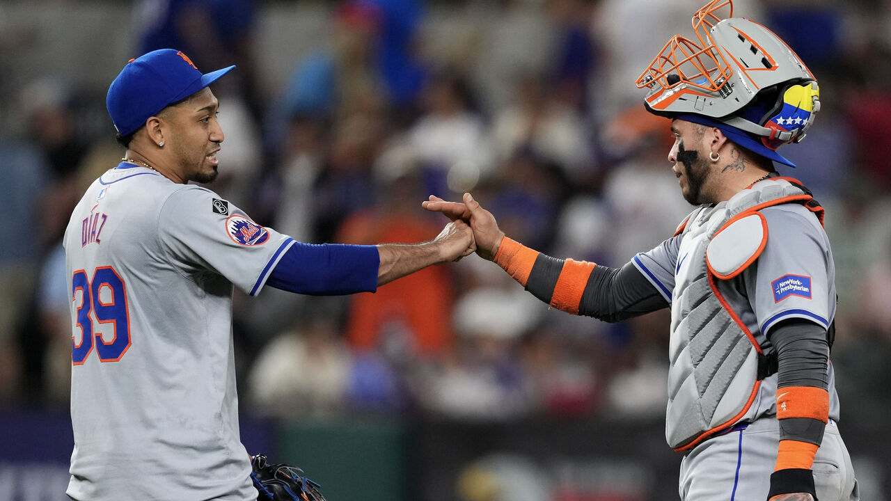 ARLINGTON, TEXAS - JUNE 18: Edwin Díaz #39 and Francisco Alvarez #4 of the New York Mets celebrate after defeating the against the Texas Rangers at Globe Life Field on June 18, 2024 in Arlington, Texas.
