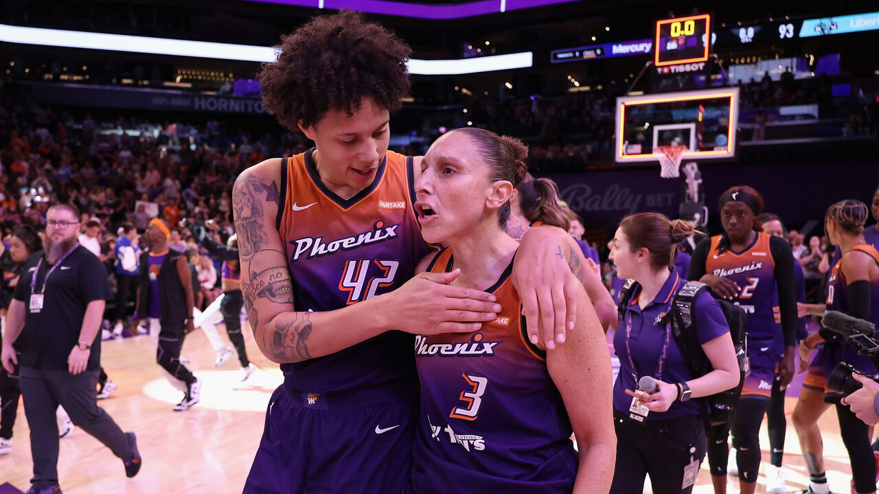 PHOENIX, ARIZONA - JUNE 18: Brittney Griner #42 and Diana Taurasi #3 of the Phoenix Mercury celebrate after defeating the New York Liberty in the WNBA game at Footprint Center on June 18, 2024 in Phoenix, Arizona. The Mercury defeated the Liberty 99-93.