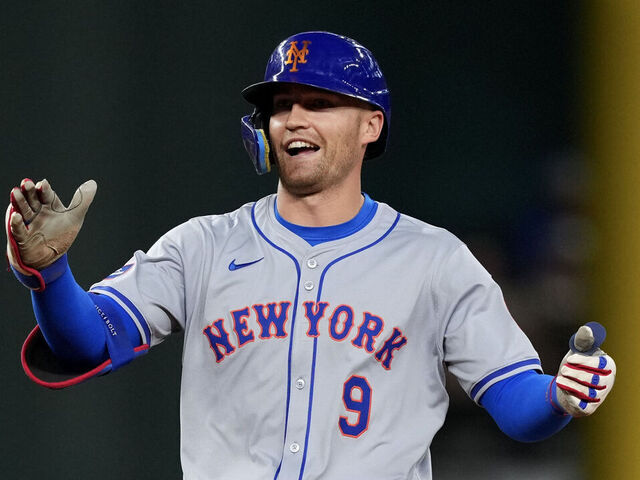 ARLINGTON, TEXAS - JUNE 19: Brandon Nimmo #9 of the New York Mets celebrates after hitting a double during the fourth inning against the Texas Rangers at Globe Life Field on June 19, 2024 in Arlington, Texas.