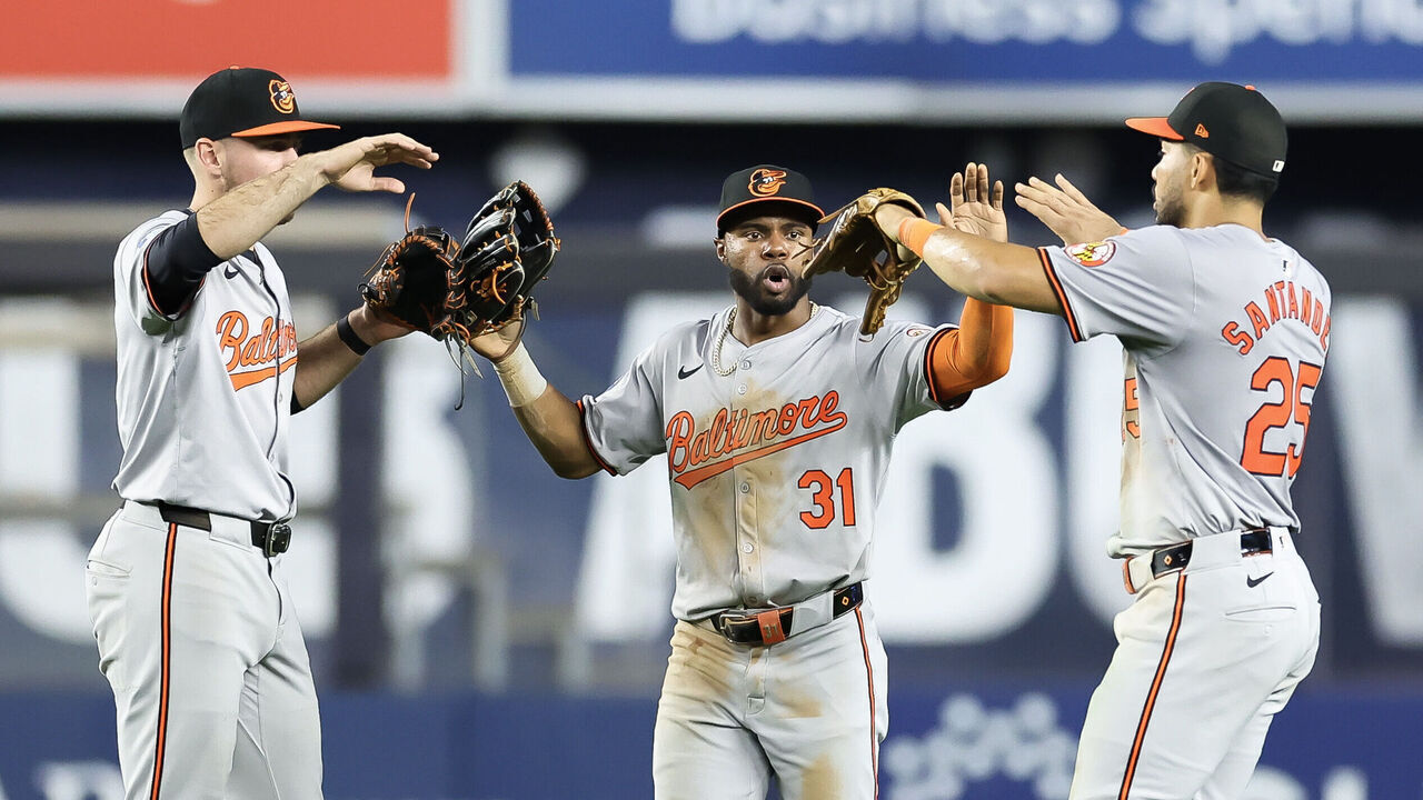 NEW YORK, NEW YORK - JUNE 19: (L-R) Colton Cowser #17, Cedric Mullins #31, and Anthony Santander #25 of the Baltimore Orioles celebrate defeating the New York Yankees at Yankee Stadium on June 19, 2024 in the Bronx borough of New York City.