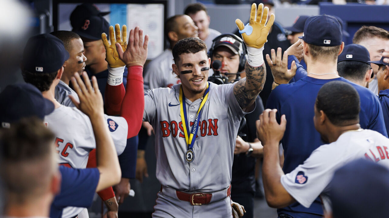 TORONTO, CANADA - JUNE 19: Jarren Duran #16 of the Boston Red Sox celebrates in the dugout after hitting a solo home run in the fifth inning of their MLB game against the Toronto Blue Jays at Rogers Centre on June 19, 2024 in Toronto, Ontario, Canada.