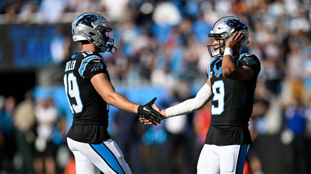 CHARLOTTE, NORTH CAROLINA - OCTOBER 29: Adam Thielen #19 of the Carolina Panthers high fives Bryce Young #9 of the Carolina Panthers during the fourth quarter of the game against the Houston Texans at Bank of America Stadium on October 29, 2023 in Charlotte, North Carolina.