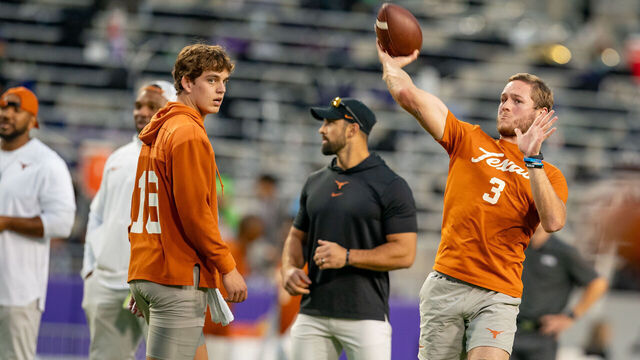 FORT WORTH, TX - NOVEMBER 11: Texas Longhorns quarterback Quinn Ewers (3) throws a pass during warmups while Texas Longhorns quarterback Arch Manning (16) watches before a game between the Texas Longhorns and TCU Horned Frogs college football game on November 11, 2023 at Amon G. Carter Stadium in Fort Worth, TX.