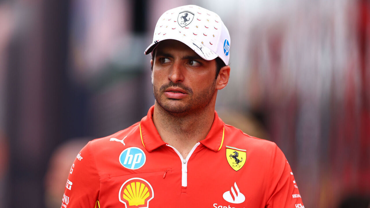 BARCELONA, SPAIN - JUNE 20: Carlos Sainz of Spain and Ferrari walks in the Paddock during previews ahead of the F1 Grand Prix of Spain at Circuit de Barcelona-Catalunya on June 20, 2024 in Barcelona, Spain.