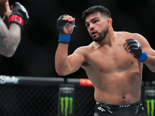 AUSTIN, TEXAS - DECEMBER 02: Kelvin Gastelum battles Sean Brady in a welterweight fight during the UFC Fight Night event at Moody Center on December 02, 2023 in Austin, Texas.
