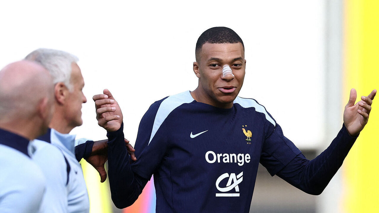 France's forward #10 Kylian Mbappe, wearing a band-aid after breaking his nose during his country's opening win against Austria, gestures during a training session within the UEFA Euro 2024 Football Championship, at the Home Deluxe Arena Stadium in Paderborn, western Germany, on June 19, 2024. Mbappe underwent tests at a hospital in Duesseldorf before rejoining the France squad at their base in Paderborn.