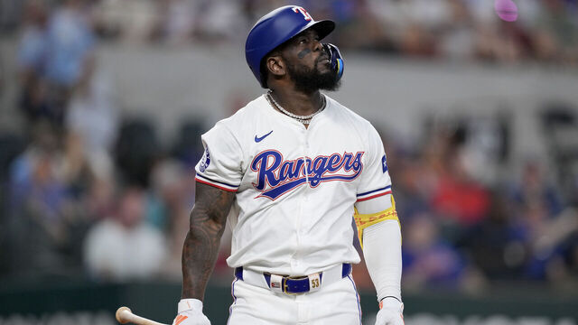 ARLINGTON, TEXAS - JUNE 17: Adolis García #53 of the Texas Rangers walks back to his dugout after striking out during the first inning against the New York Mets at Globe Life Field on June 17, 2024 in Arlington, Texas.