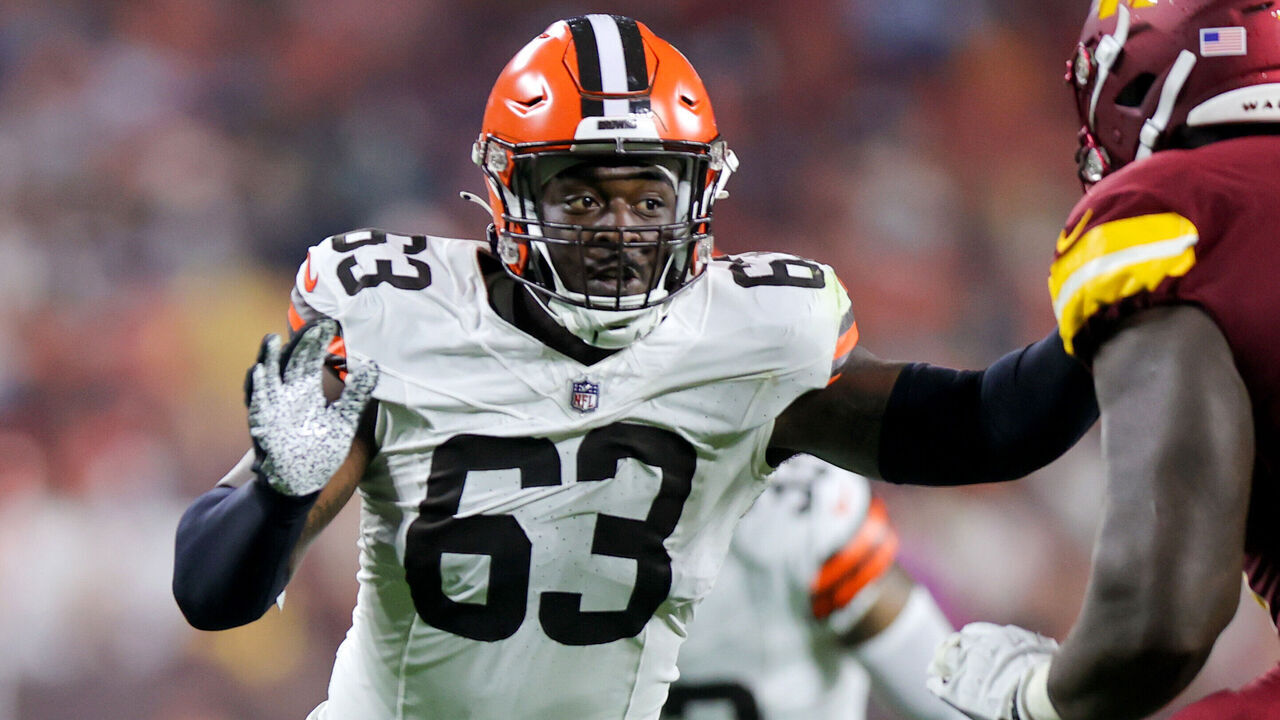CLEVELAND, OH - AUGUST 11: Cleveland Browns defensive end Lonnie Phelps (63) fights off the block of Washington Commanders offensive tackle Cornelius Lucas (78) during the second quarter of the National Football League preseason game between the Washington Commanders and Cleveland Browns on August 11, 2023, at Cleveland Browns Stadium in Cleveland, OH.