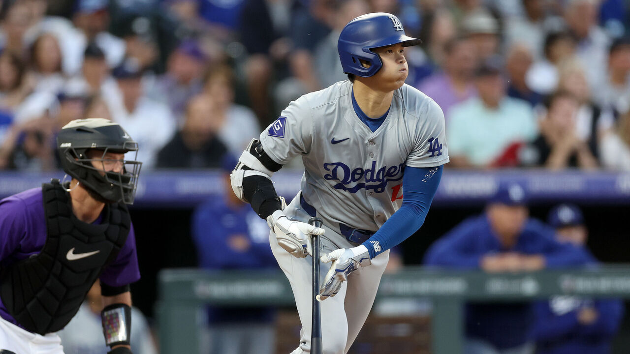 DENVER, COLORADO - JUNE 19: Shohei Ohtani #17 of the Los Angles Dodgers hits a single against the Colorado Rockies in the sixth inning at Coors Field on June 19, 2024 in Denver, Colorado.