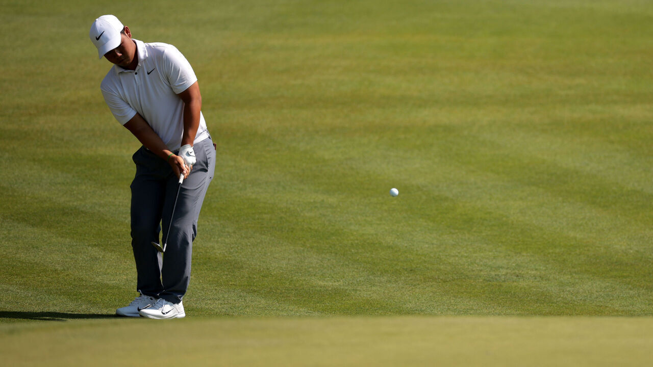 CROMWELL, CONNECTICUT - JUNE 20: Tom Kim of South Korea putts on the 15th green during the first round of the Travelers Championship at TPC River Highlands on June 20, 2024 in Cromwell, Connecticut.