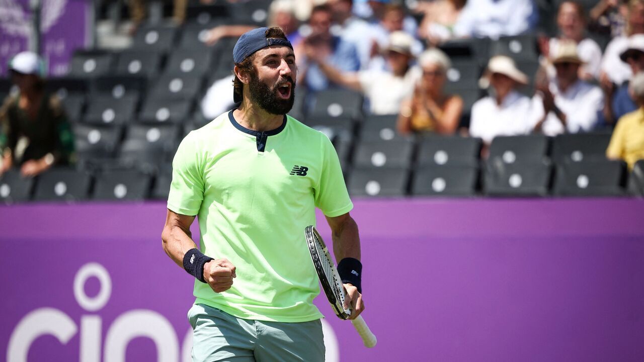 Australia's Jordan Thompson celebrates after winning against US player Taylor Fritz during their men's singles quarter-finals tennis match at the Cinch ATP tennis Championships at Queen's Club in west London on June 21, 2024.