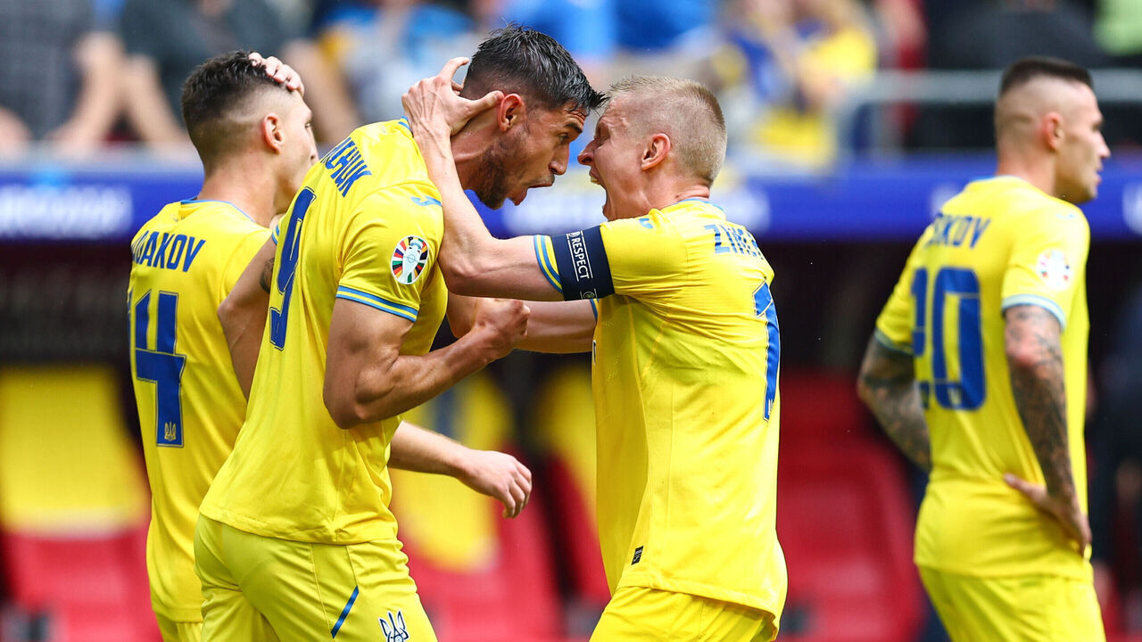 DUSSELDORF, GERMANY - JUNE 21: Roman Yaremchuk of Ukraine celebrates their second goal with Oleksandr Zinchenko of Ukraine during the UEFA EURO 2024 group stage match between Slovakia and Ukraine at Dusseldorf Arena on June 21, 2024 in Dusseldorf, Germany.