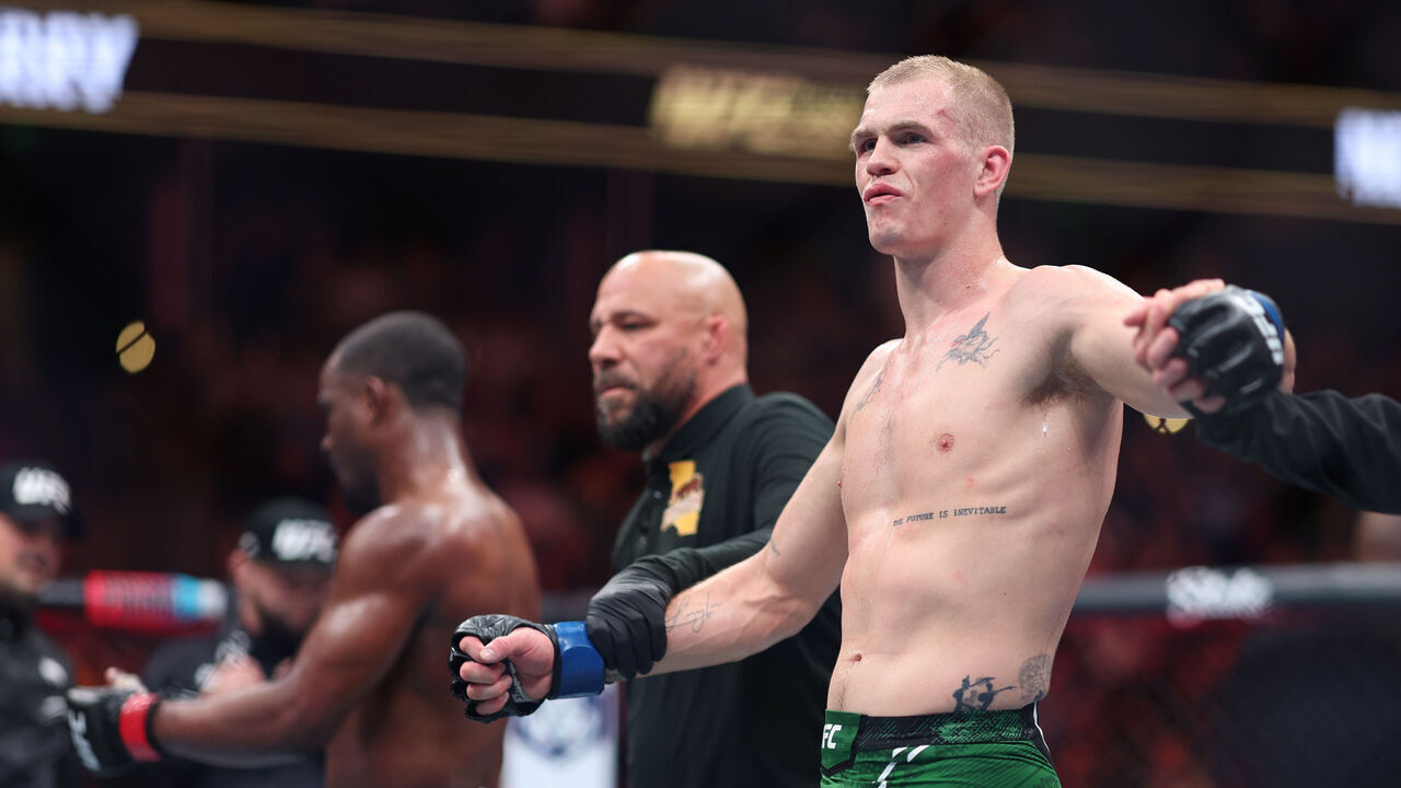 ANAHEIM, CALIFORNIA - FEBRUARY 17: Ian Garry of Ireland celebrates defeating Geoff Neal by split decision in their welterweight fight during UFC 298 at Honda Center on February 17, 2024 in Anaheim, California.