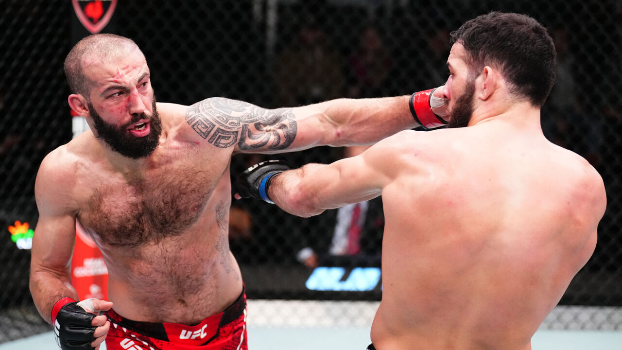 LAS VEGAS, NEVADA - FEBRUARY 03: (L-R) Roman Dolidze of Georgia punches Nassourdine Imavov of Russia in a middleweight fight during the UFC Fight Night event at UFC APEX on February 03, 2024 in Las Vegas, Nevada.