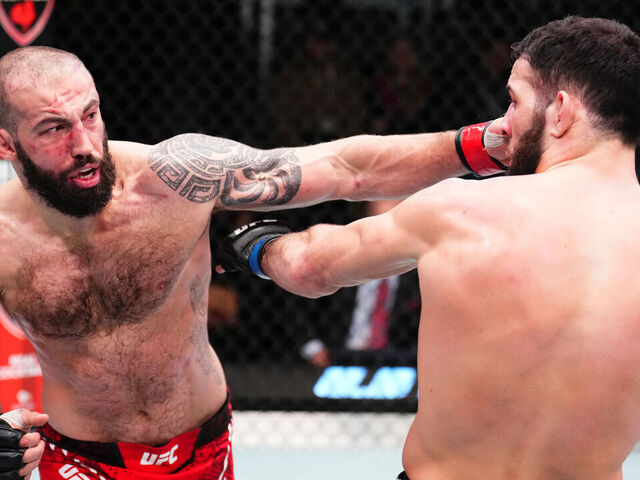 LAS VEGAS, NEVADA - FEBRUARY 03: (L-R) Roman Dolidze of Georgia punches Nassourdine Imavov of Russia in a middleweight fight during the UFC Fight Night event at UFC APEX on February 03, 2024 in Las Vegas, Nevada.