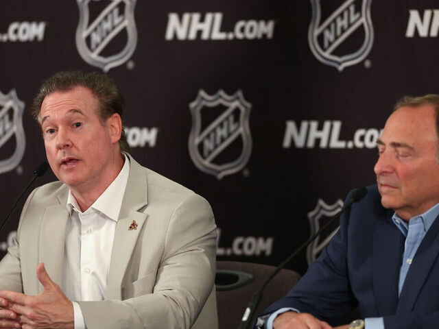 PHOENIX, ARIZONA - APRIL 19: Coyotes Chairman and Governor Alex Meruelo (L) speaks alongside NHL Commissioner Gary Bettman during a press conference at Hyatt Regency Phoenix on April 19, 2024 in Phoenix, Arizona. The NHL unanimously approved a $1.2 billion sale from Alex Meruelo to Utah Jazz owners Ryan and Ashley Smith, allowing the franchise's move to Salt Lake City to begin play as a new franchise next season.