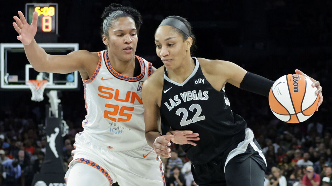 LAS VEGAS, NEVADA - JUNE 21: A'ja Wilson #22 of the Las Vegas Aces drives to the basket against Alyssa Thomas #25 of the Connecticut Sun in the third quarter of their game at Michelob ULTRA Arena on June 21, 2024 in Las Vegas, Nevada. The Aces defeated the Sun 85-74.