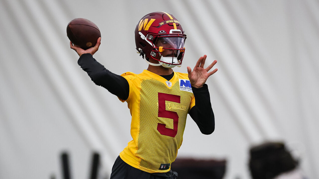 ASHBURN, VA - MAY 10: Jayden Daniels #5 of the Washington Commanders attempts a pass during Washington Commanders Rookie Minicamp at OrthoVirginia Training Center on May 10, 2024 in Ashburn, Virginia.
