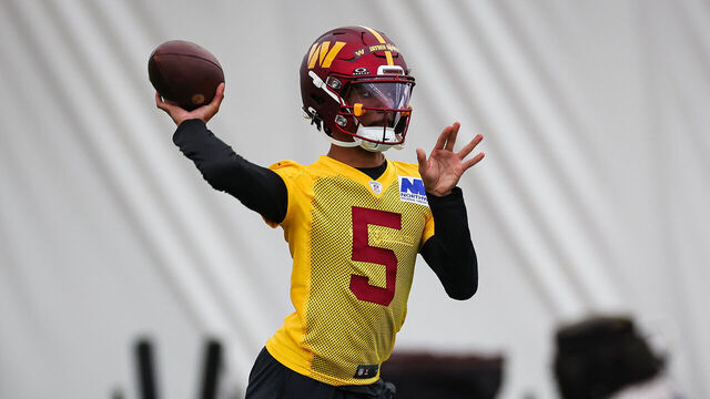 ASHBURN, VA - MAY 10: Jayden Daniels #5 of the Washington Commanders attempts a pass during Washington Commanders Rookie Minicamp at OrthoVirginia Training Center on May 10, 2024 in Ashburn, Virginia.