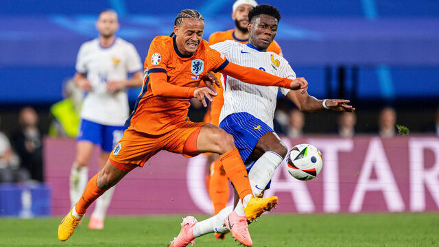 LEIPZIG, GERMANY - JUNE 21: Xavi Simons of Netherlands is challenged by Aurelien Tchouameni of France during the UEFA EURO 2024 group stage match between Netherlands and France at Football Stadium Leipzig on June 21, 2024 in Leipzig, Germany.