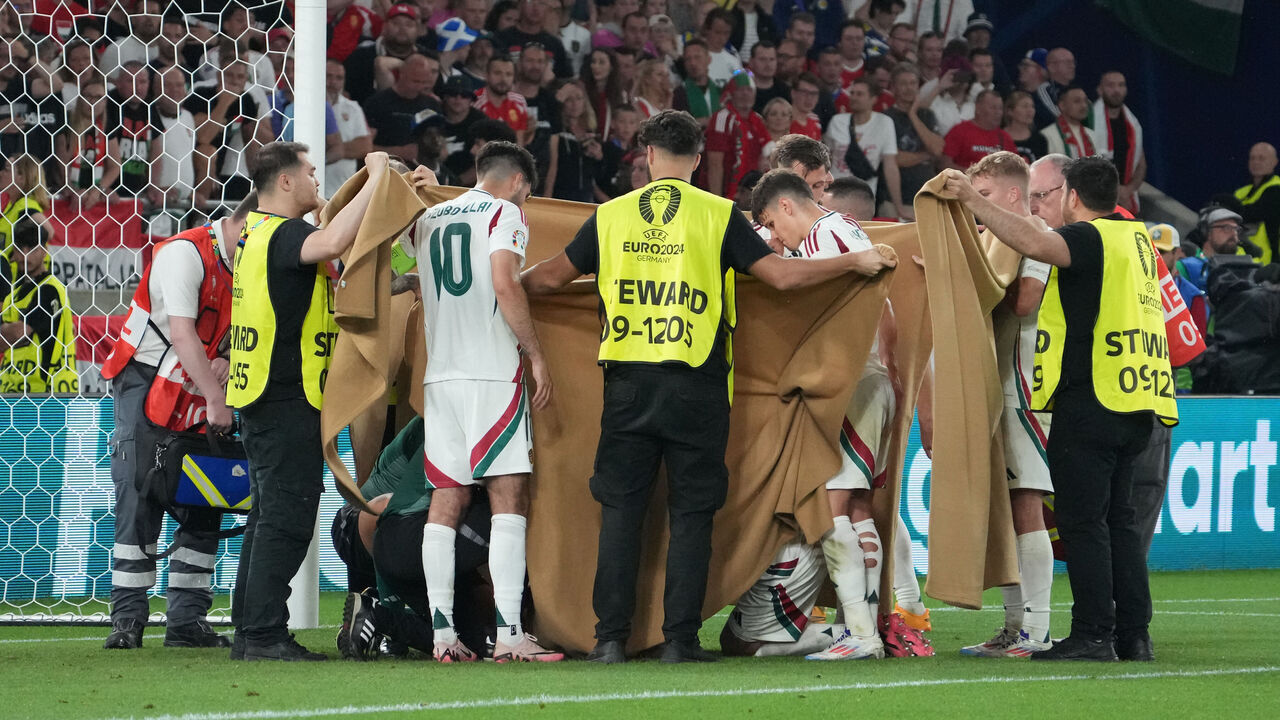 STUTTGART, GERMANY - JUNE 23: Barnabas Varga of Hungary gets medical treatment after getting injured during the UEFA EURO 2024 group stage match between Scotland and Hungary at Stuttgart Arena on June 23, 2024 in Stuttgart, Germany.